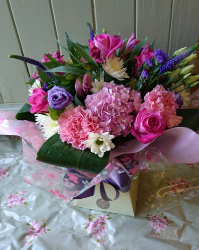Fresh Love - Bright seasonal flowers arranged in a hand tie and presented in an aqua box. Nice mix of colours such as shades of pink, purple, whites with lush greenery.