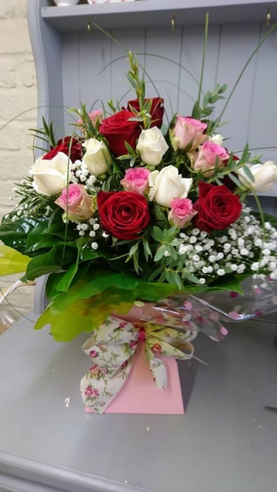 With Love - Beautiful fresh flowers in water presented in a gift box. To include roses in red, white and pink with lush foliage.